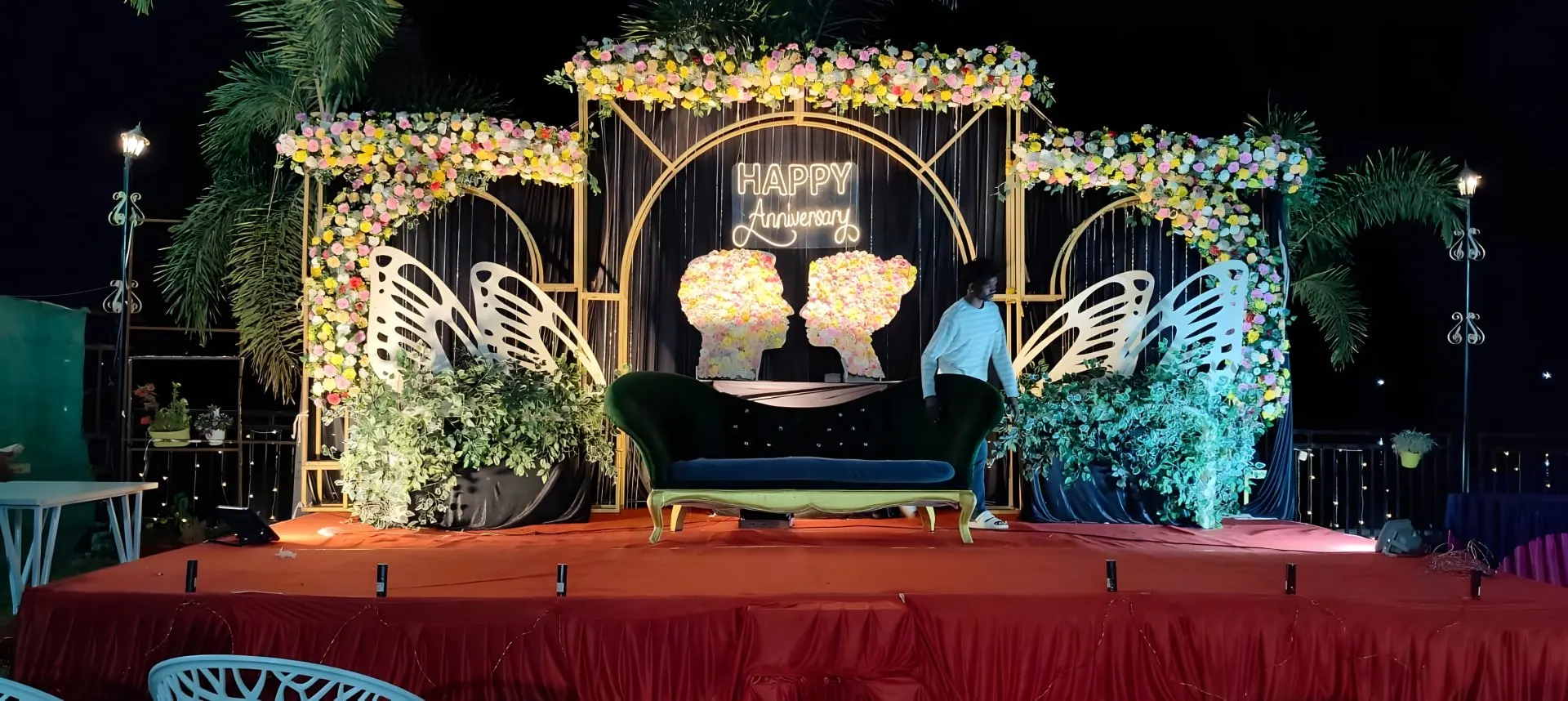 A decorated stage on the lawn at night